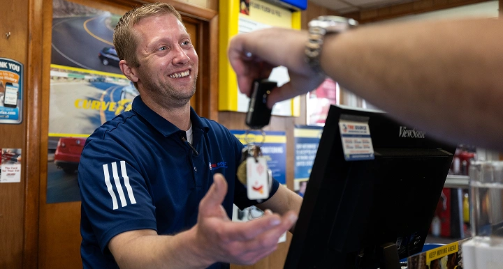 Tire Source employee serving a customer