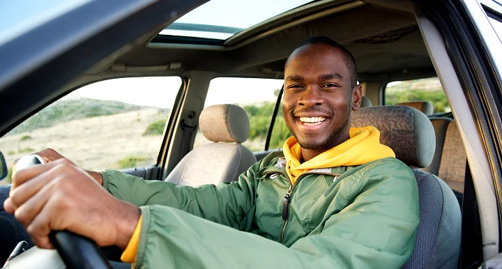 man driving car