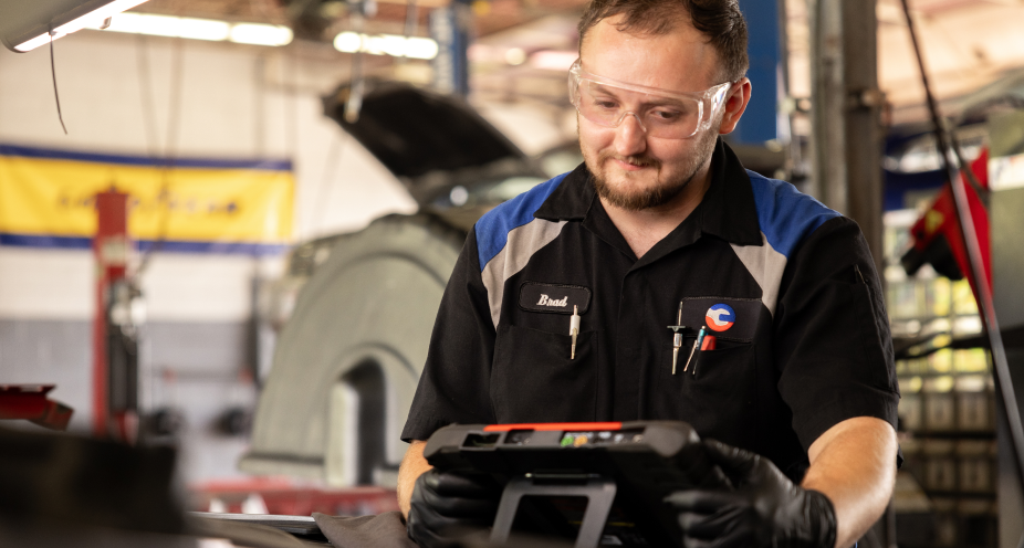 Technician working on a car